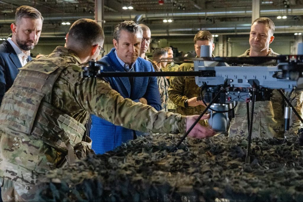 Defense Secretary Pete Hegseth with soldiers